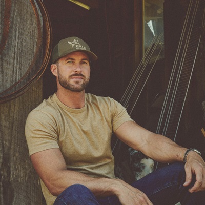 Riley Green hanging out in a barn