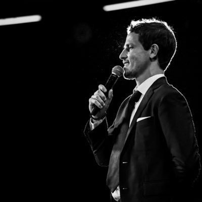 tony hinchcliffe talking into a microphone