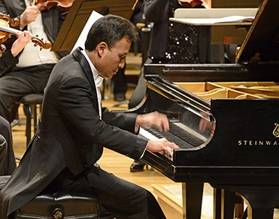 Jon Nakamatsu playing on a piano