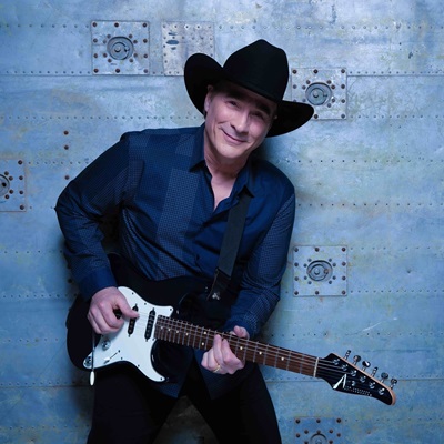 clint black playing the guitar